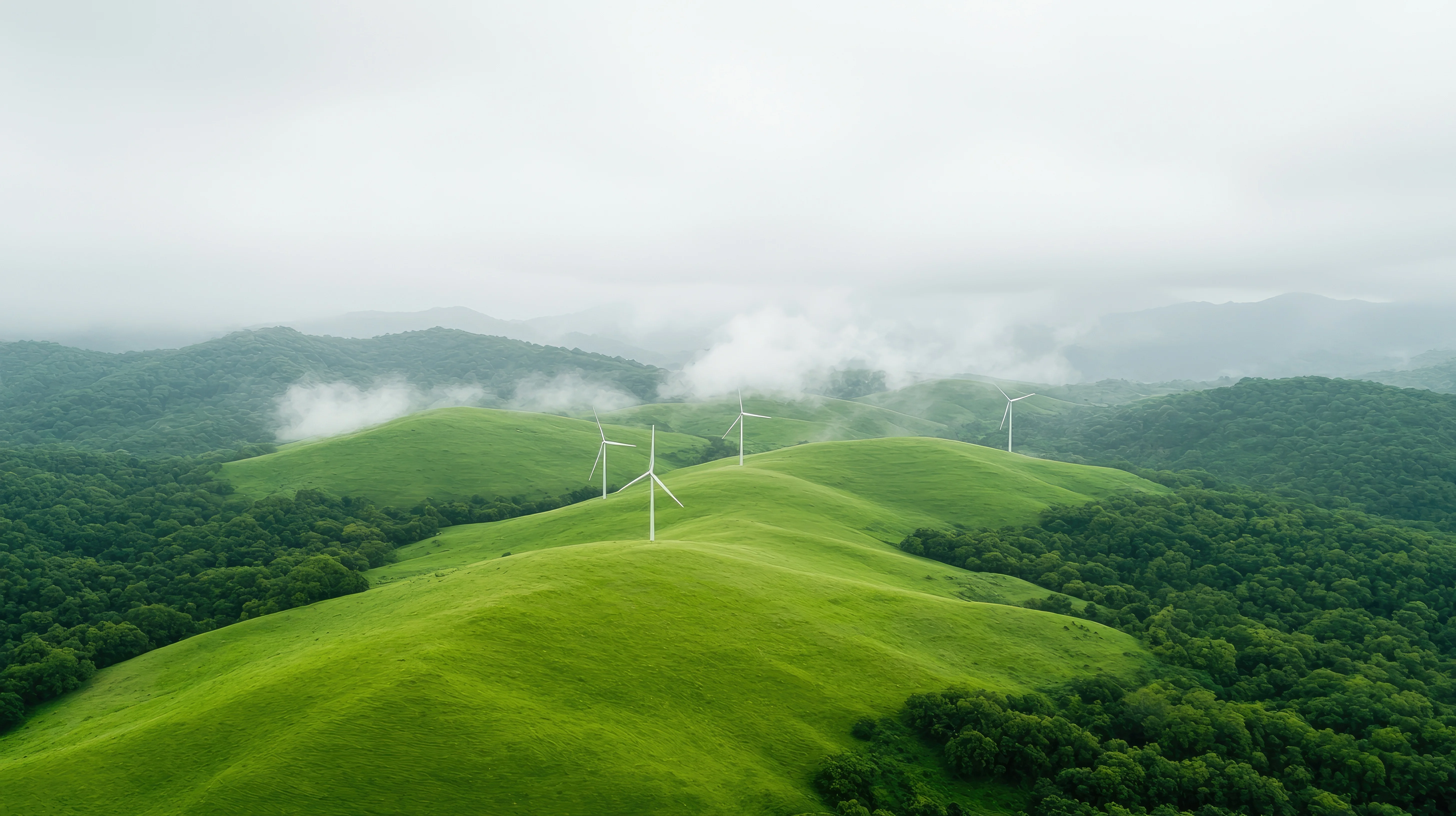 Wind turbines on rolling green hills